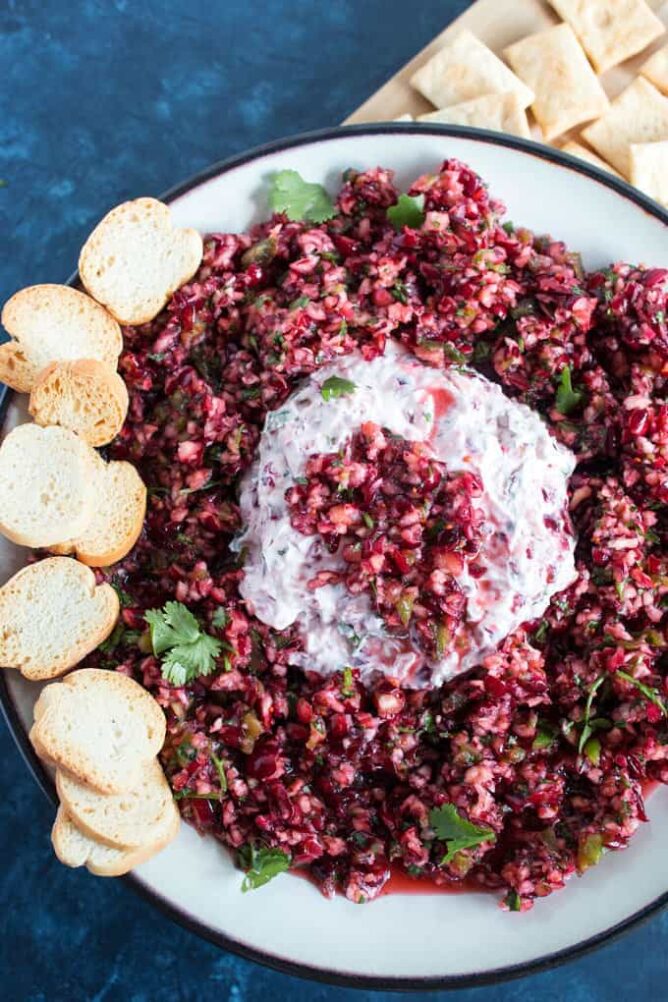 Cranberry Jalapeno Cream Cheese Appetizer on a plate with crackers.