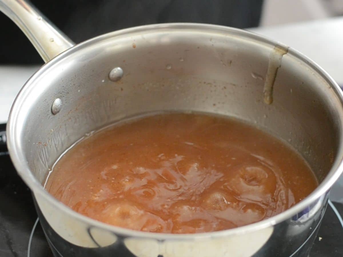 saucepan with boiling thickened cinnamon sugar water