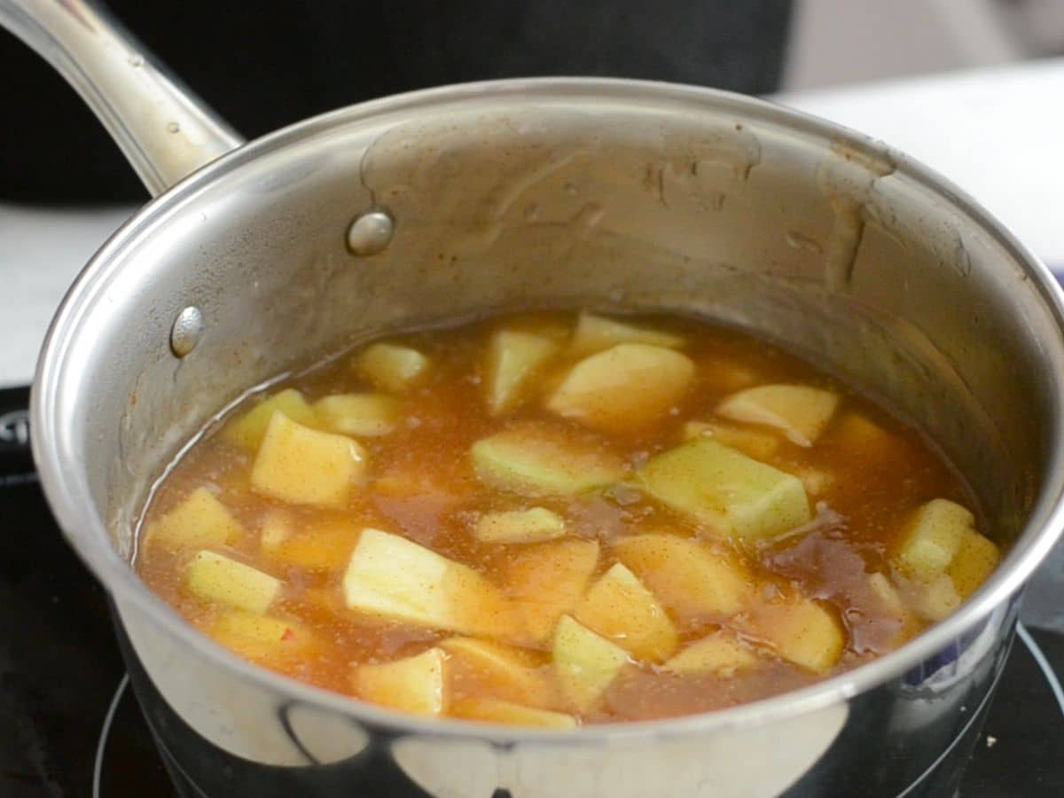 saucepan with apple pie filling inside.