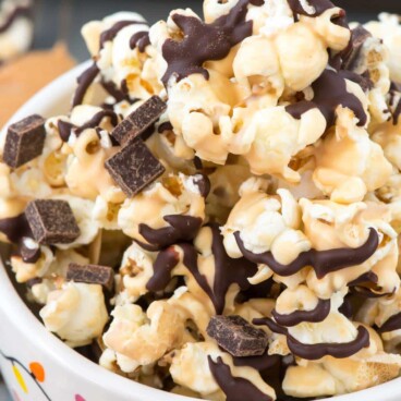 Chocolate Peanut Butter Popcorn is an easy snack or dessert that's perfect for gifting! Just 4 simple ingredients for a delicious holiday treat.