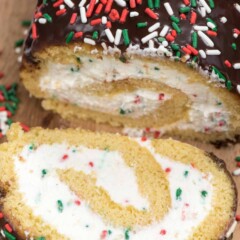 Make this Christmas Cake Roll for the perfect holiday dessert! A yellow cake roll filled with cream cheese whipped cream and sprinkles perfect for Christmas!