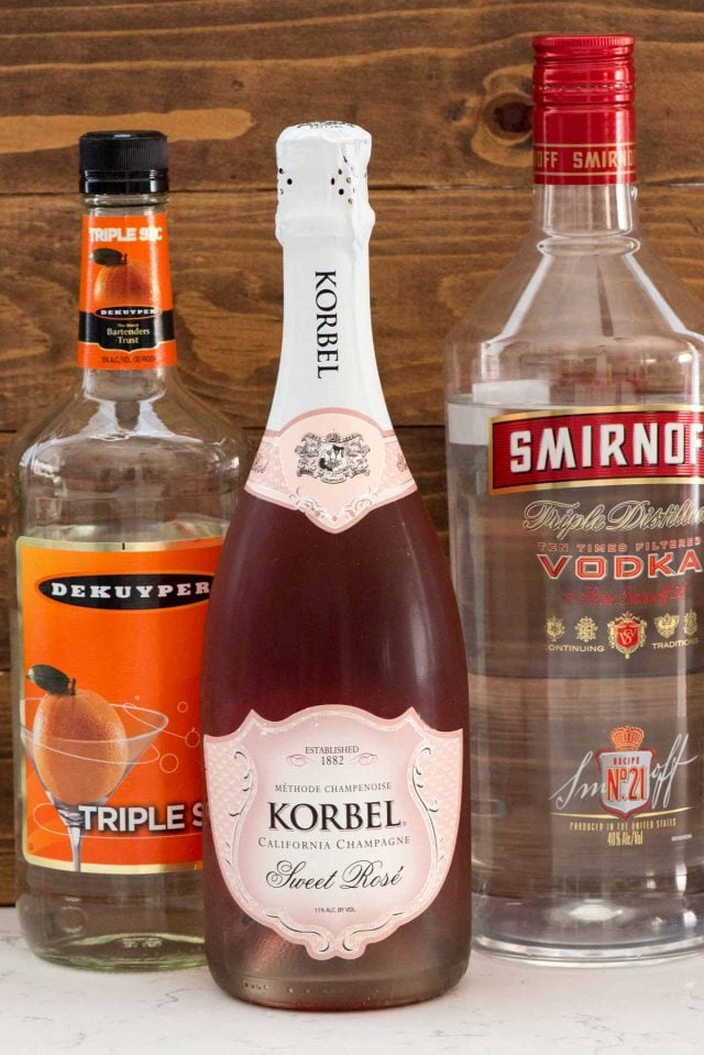Three ingredients to make the Pink Champagne Punch: Triple Sec, Pink Champagne, and Vodka