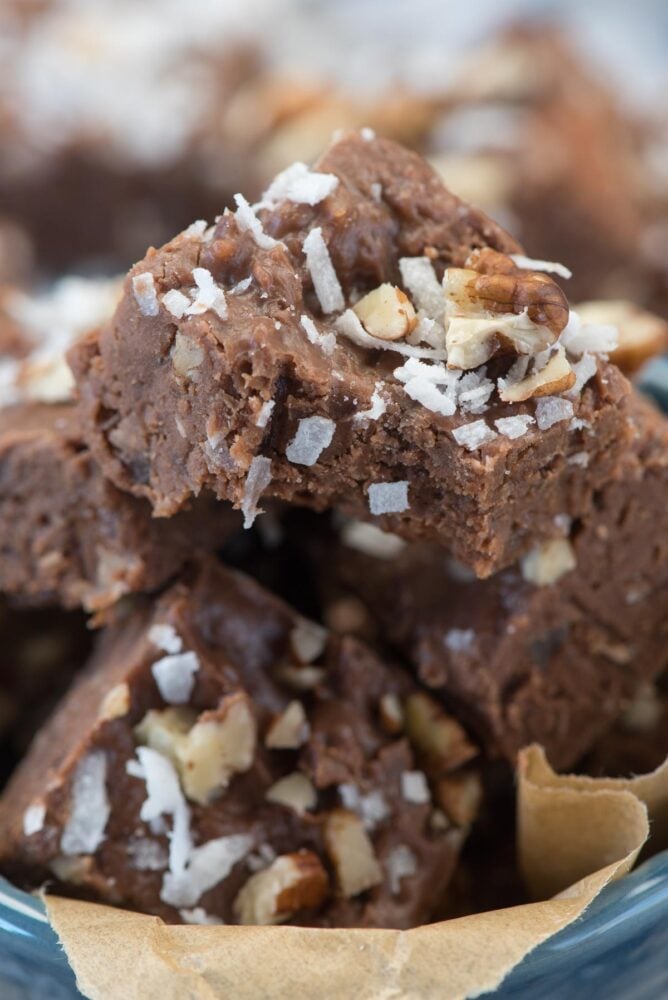 Coconut Pecan Fudge stack with a bite out of the top piece