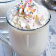 Spiked Crockpot White Hot Chocolate made with coffee creamer for flavor and cake vodka to make this takes like a birthday cake hot chocolate!