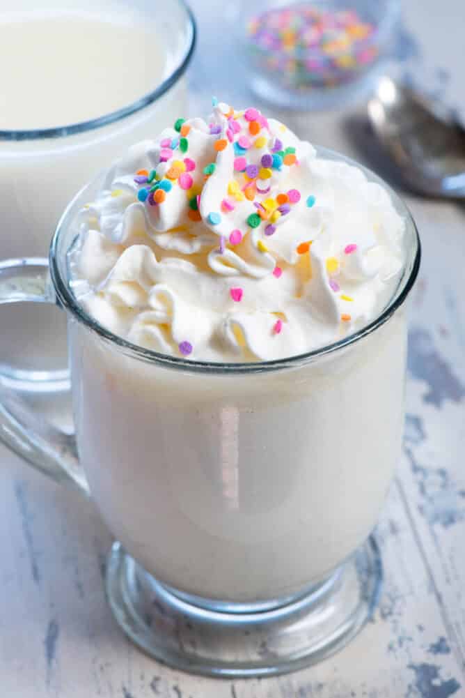 Spiked Crockpot White Hot Chocolate in a glass mug