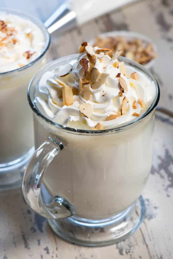 Crockpot White Hot Chocolate Spiked with amaretto in a glass mug