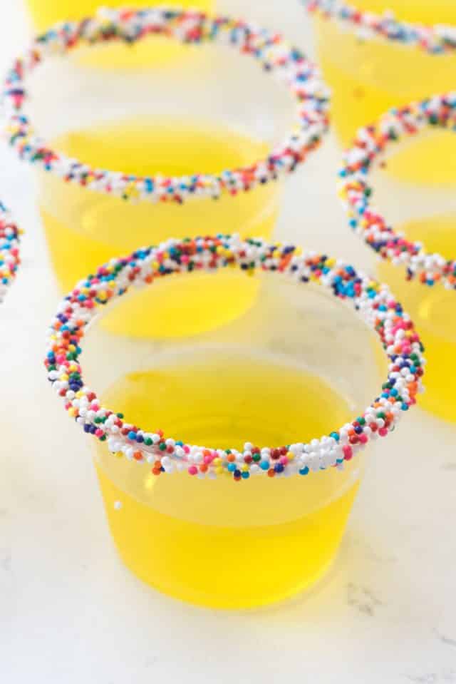 Lemon Cake Jell-O shots stack with sprinkles