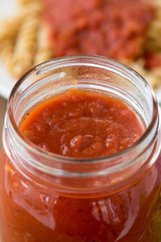 closeup of tomato sauce in jar