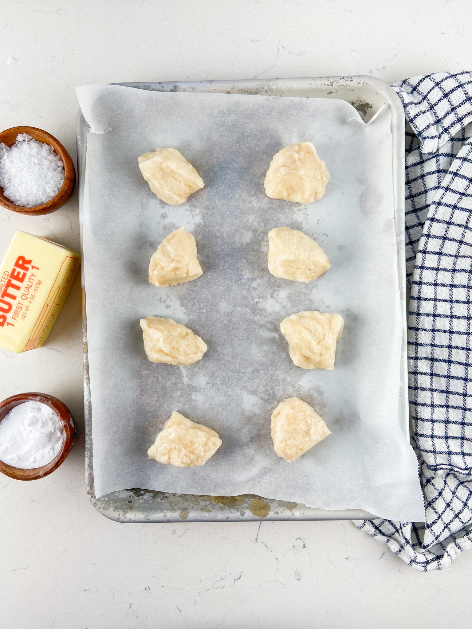 raw pretzel bites on parchment paper.