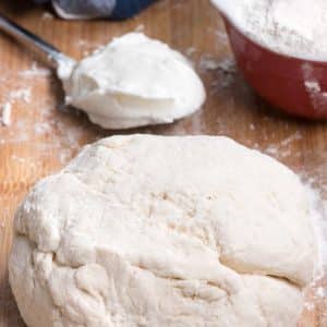 pizza dough on cutting board