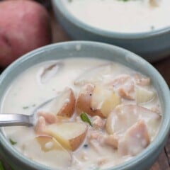 bowl of clam chowder with spoon inside