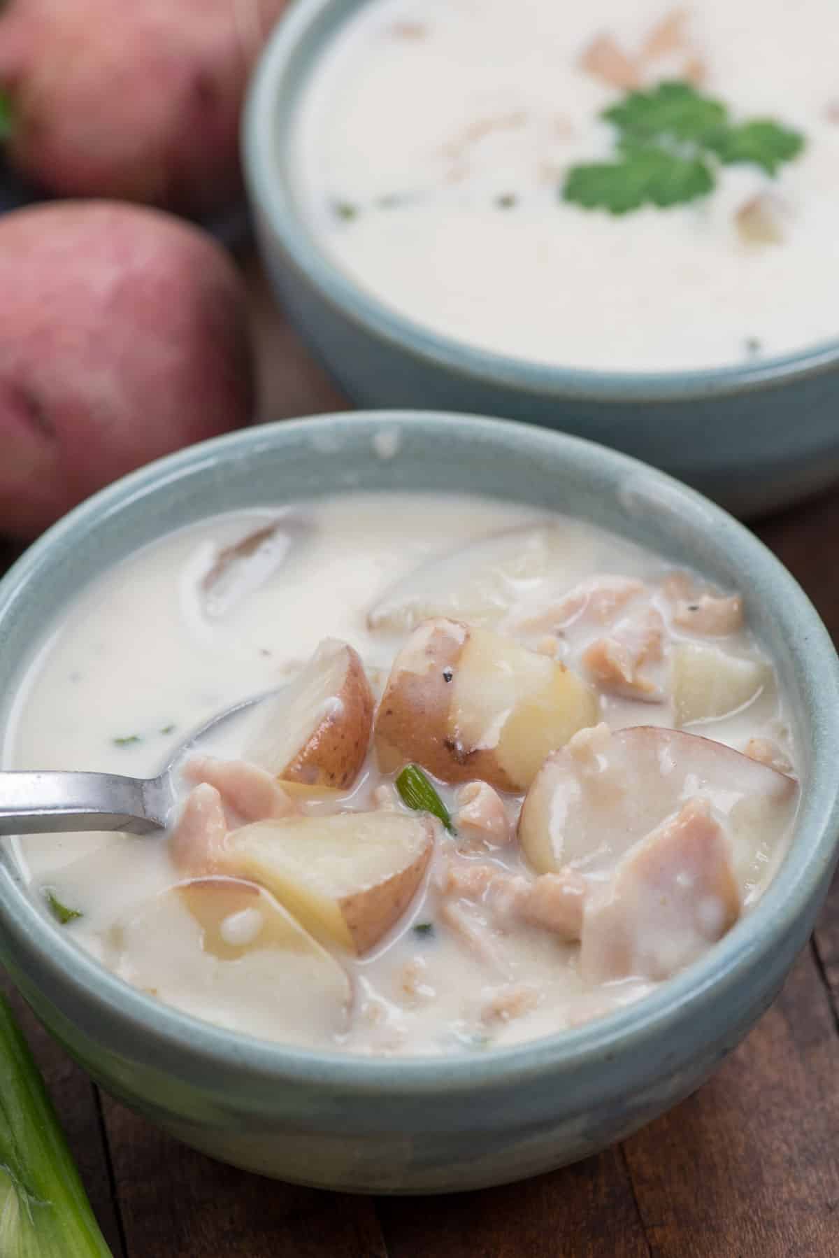 bowl of clam chowder with spoon inside
