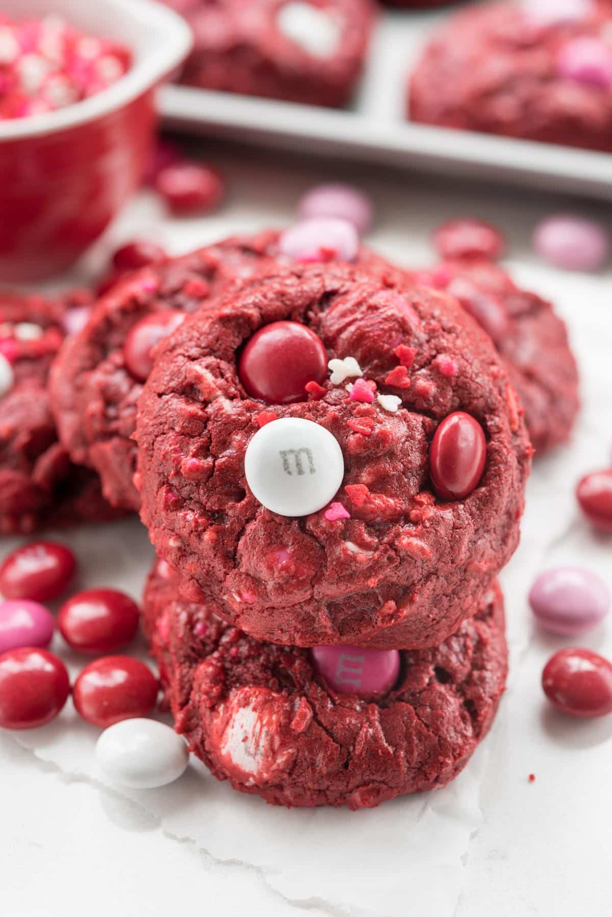 stack of red velvet cookies with M&Ms