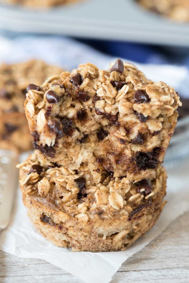 Stack of chocolate chip baked oatmeal muffins on parchment paper