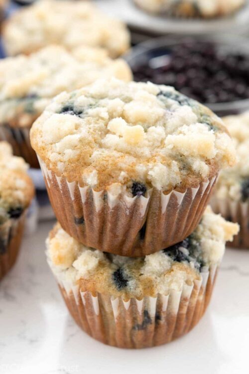 Stack of Blueberry Cream Cheese Muffins on a counter