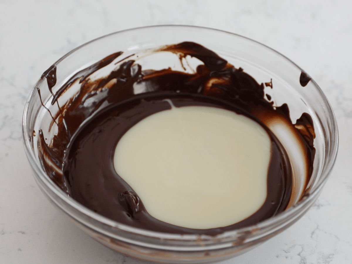 bowl of melted chocolate with sweetened condensed milk.