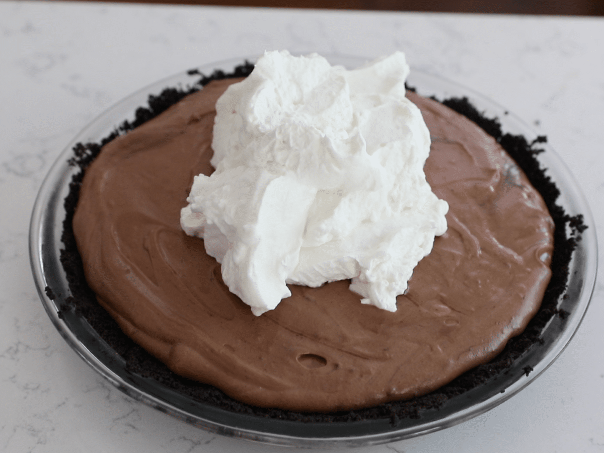 oreo pie with chocolate filling and whipped cream.