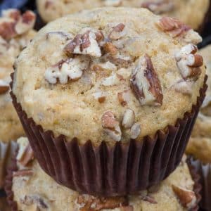 stack of banana nut muffins in brown liners