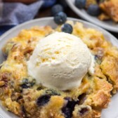 dump cake on white plate with ice cream