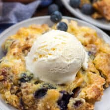 dump cake on white plate with ice cream