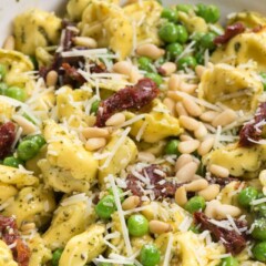 Pesto Tortellini Salad in a white bowl