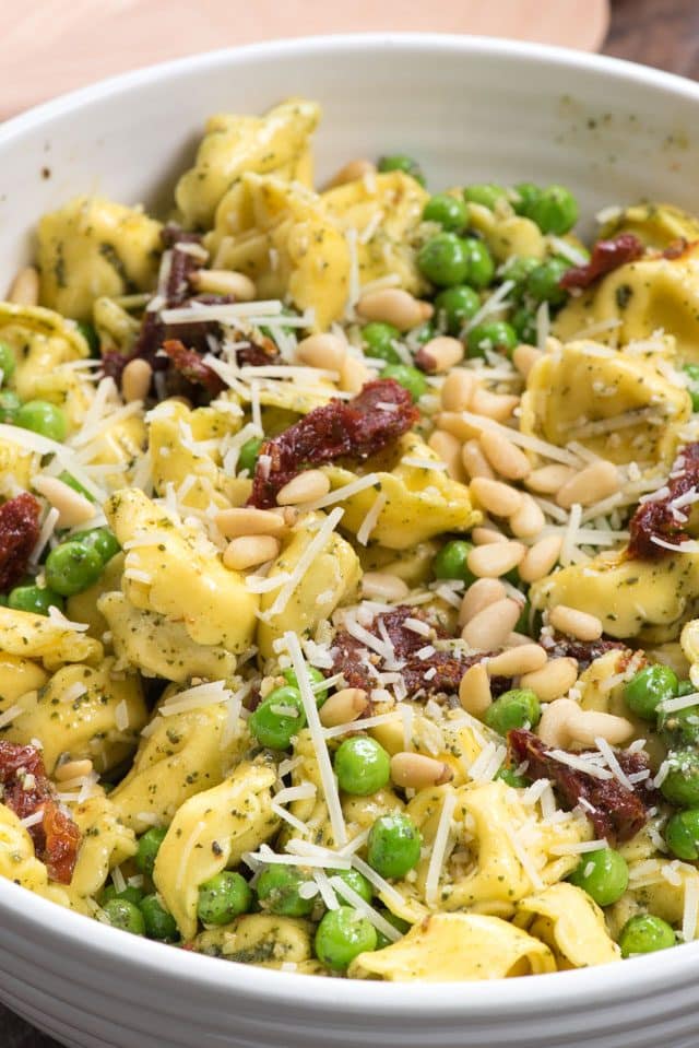 Pesto Tortellini Salad in a white bowl