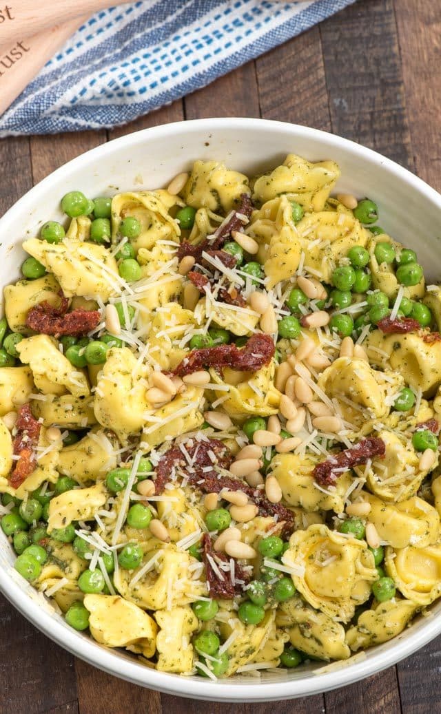 overhead shot of pesto tortellini salad in bowl