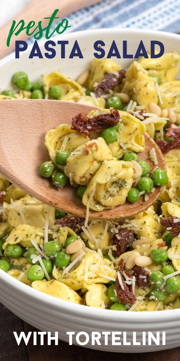 pesto tortellini salad in bowl with spoon