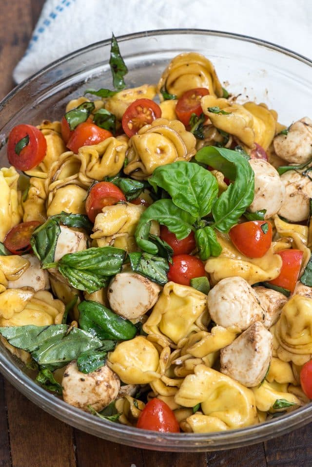 overhead shot of caprese pasta salad in bowl