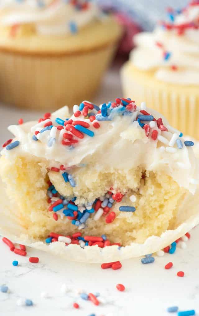 Fireworks Cupcake sitting on a cupcake wrapper and cut so you can see the middle