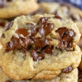 stack of cookies with top one cut open and gooey.