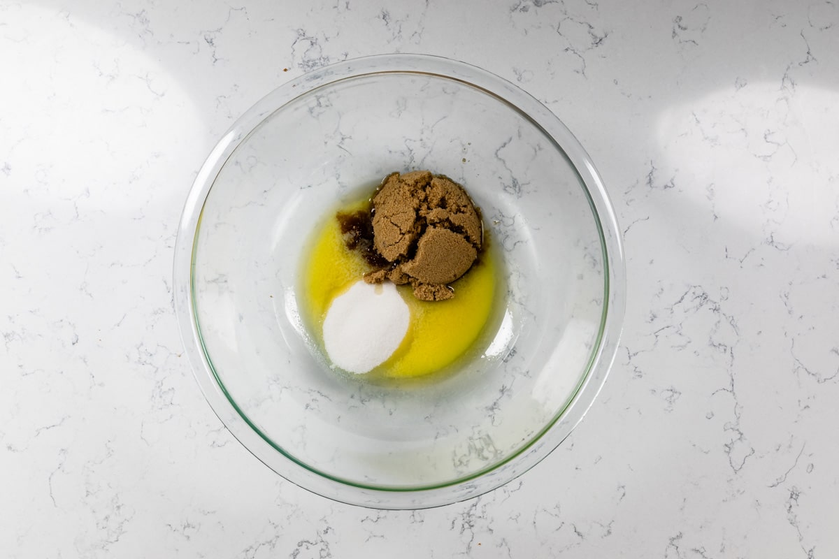 glass bowl with melted butter and sugars.
