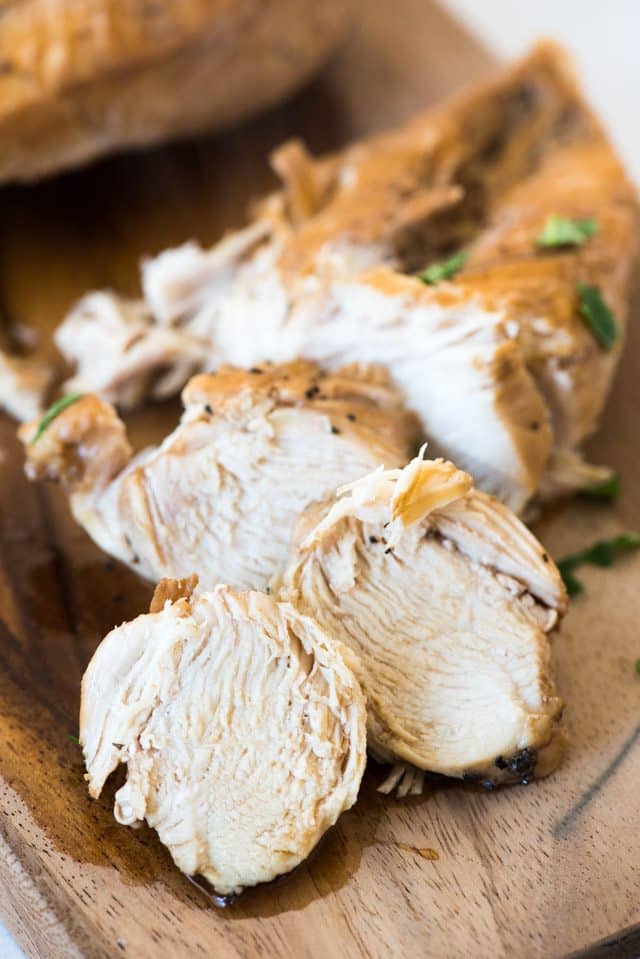 Instant Pot Chicken slices on a cutting board