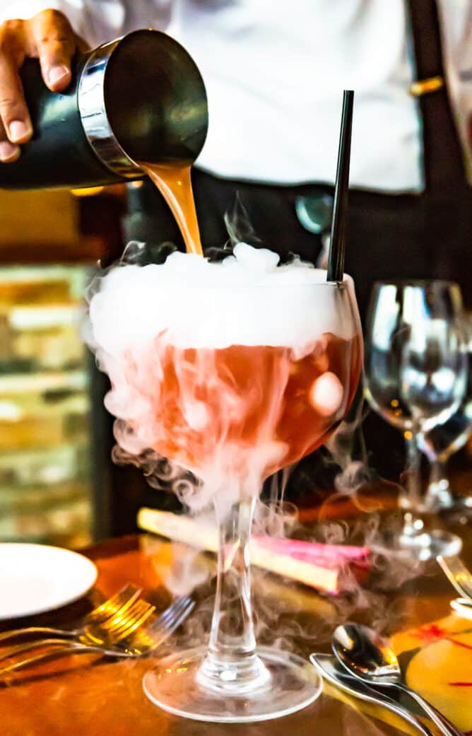 Cocktail being poured into a glass at Voodoo Steak in Las Vegas