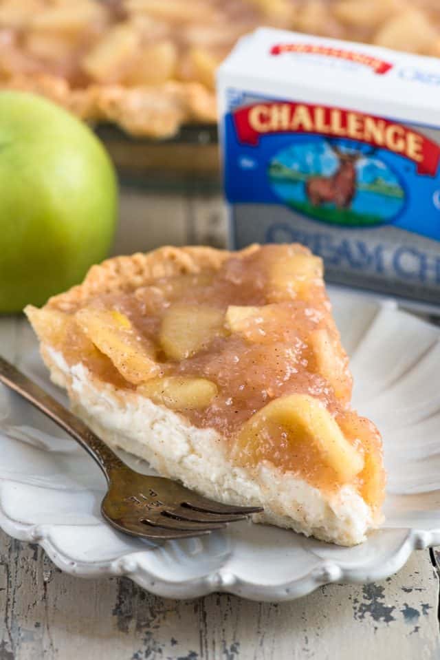 slice of cheesecake apple pie on white plate