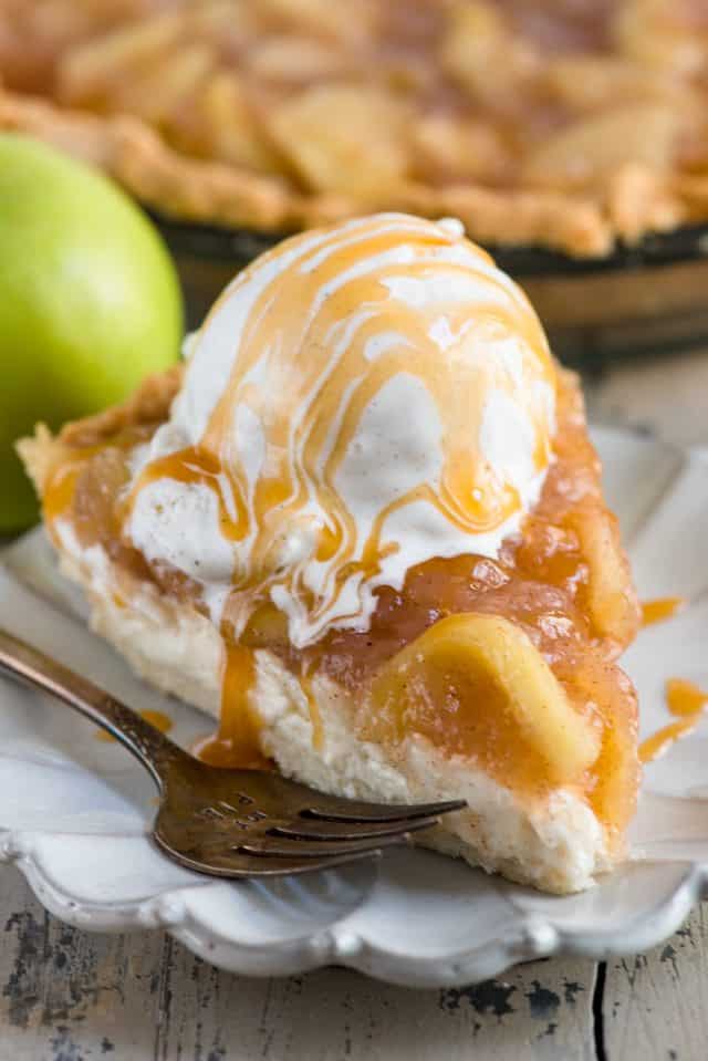 slice of cheesecake apple pie on white plate