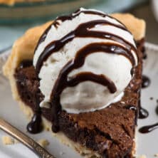 slice of chocolate fudge pie with ice cream