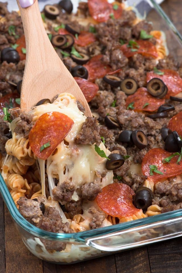 Pizza pasta casserole with wooden spoon