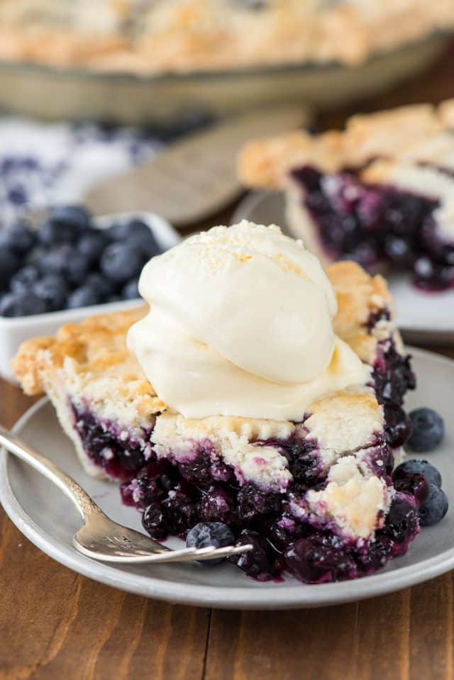 slice of blueberry pie with ice cream