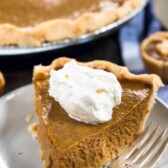 slice of pumpkin pie with whipped cream