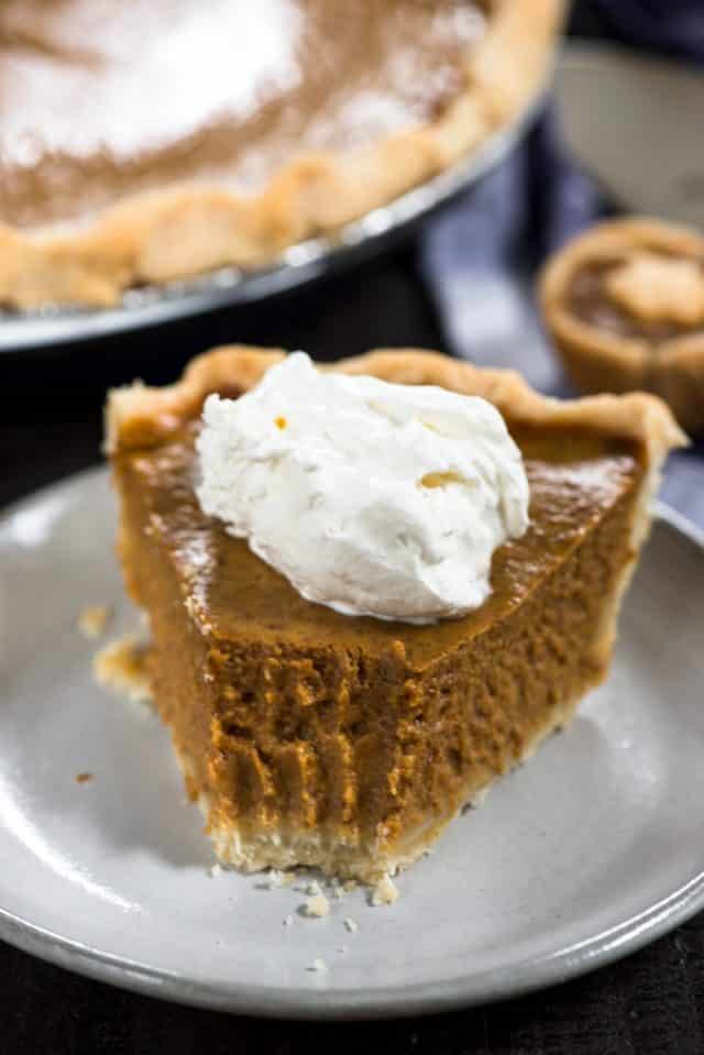 slice of pumpkin pie with bite taken out