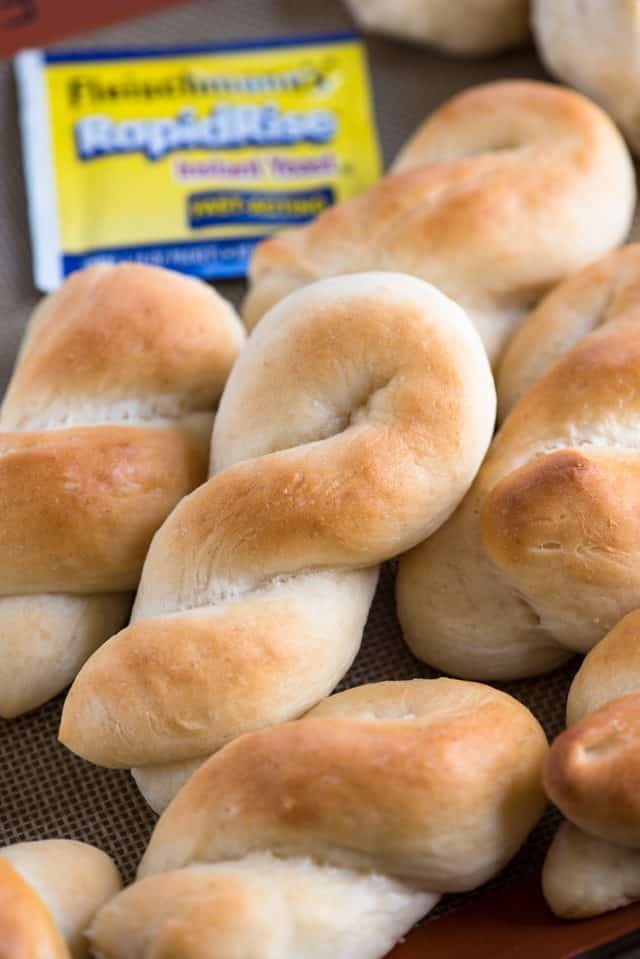 Bunch of Buttery Homemade Rolls with Yeast in the background