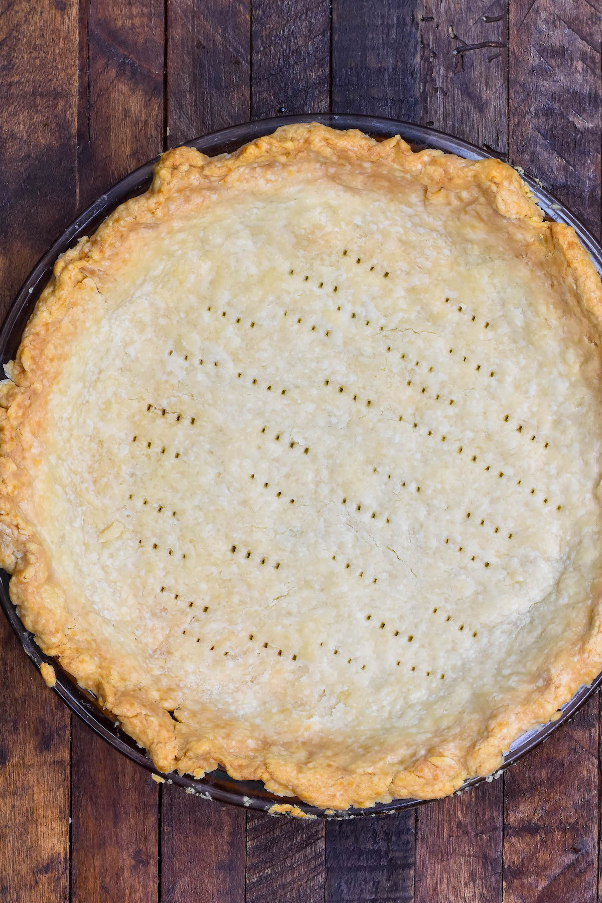 baked pie crust on brown background