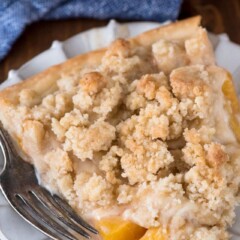 slice of peach crumble pie