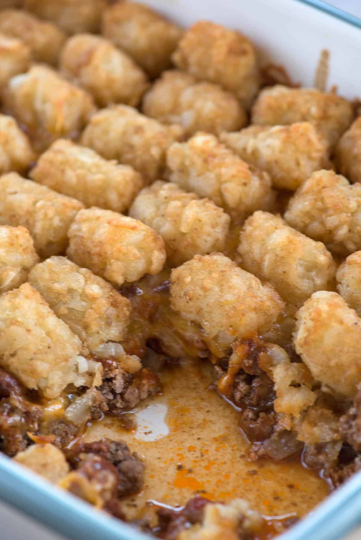 pan with tater tot casserole missing a slice