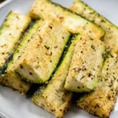 parmesan roasted zucchini on white plate