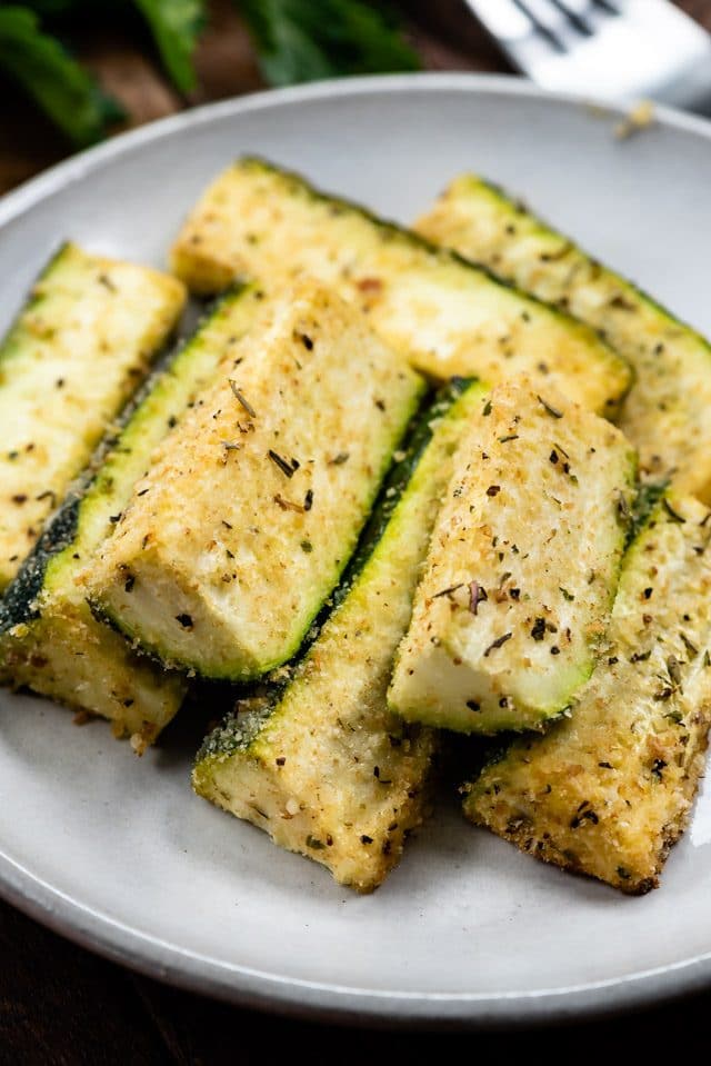 parmesan roasted zucchini on white plate