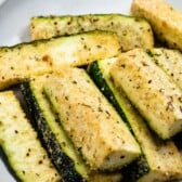 parmesan roasted zucchini on white plate