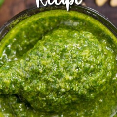 jar of pesto with spoon holding some and words on photo