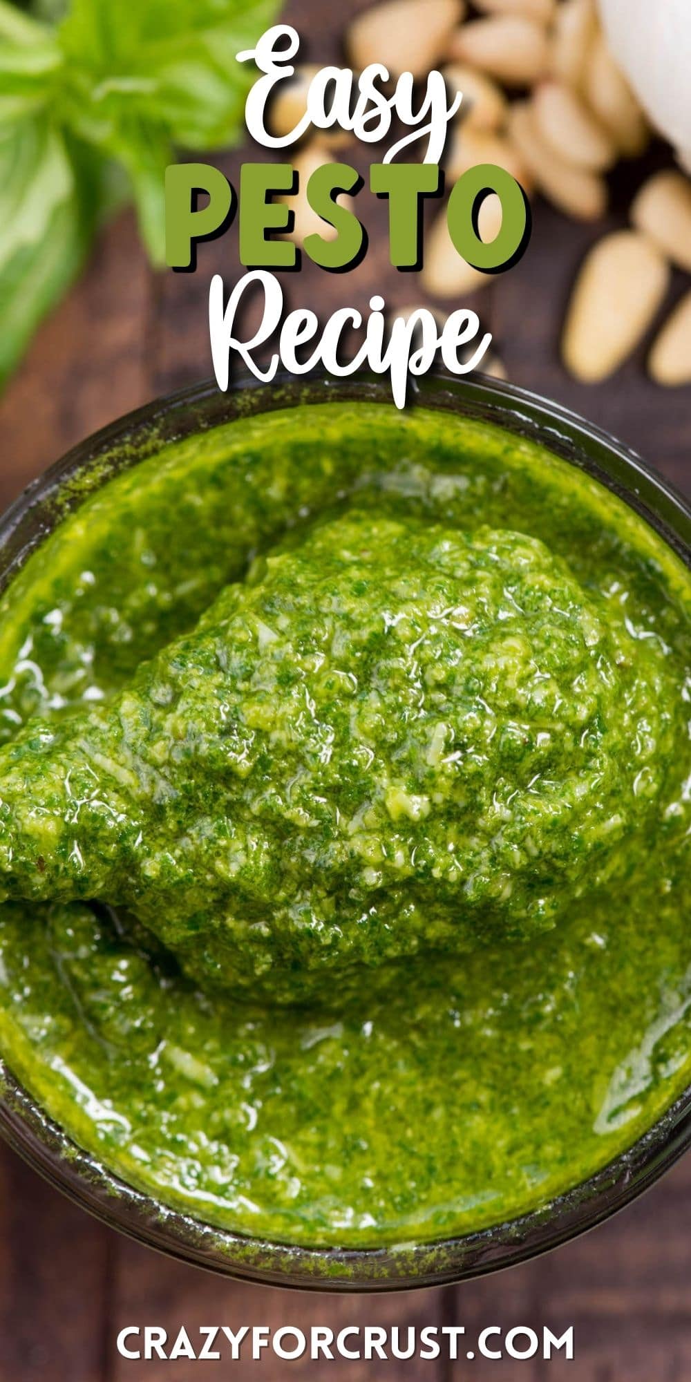 jar of pesto with spoon holding some and words on photo